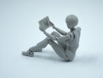 articulated figure looking at a tablet by Brent Jordan on Unsplash